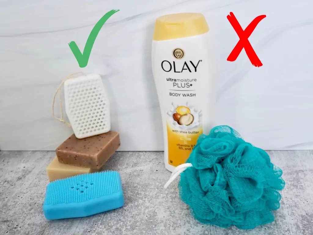 white and sky blue sud stud silicone soap sleeve on top of body soap bars nect to olay body wash and teal loofah